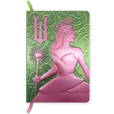 Notebook with pink design of a woman holding a sunflower and a green emblem on a green background