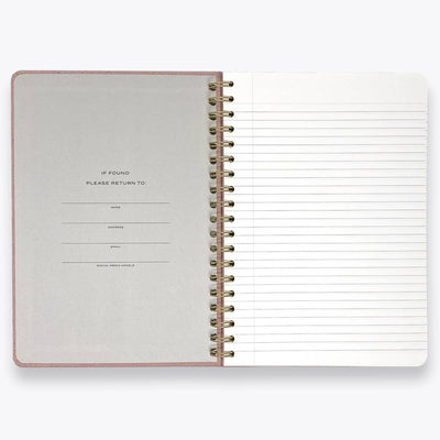 Open spiral-bound notebook with lined pages on a white background