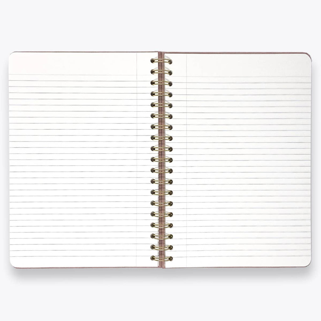 Open notebook with lined pages and a metal spiral binding on a white background