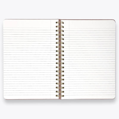 Open notebook with lined pages and a metal spiral binding on a white background